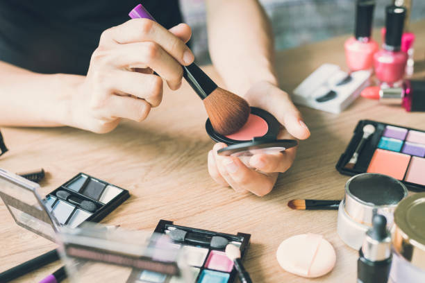 istock Girl doing makeup on dressing table with cosmetics 648649026