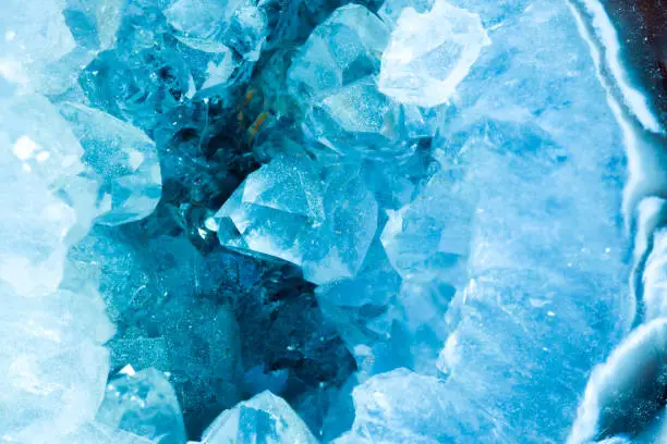 cross section slice detail macro of a aquamarine color geode.Beautiful natural crystals gemstone. Extreme close up macro shot.