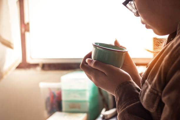 istock The girl was holding a coffee at work. 648659718
