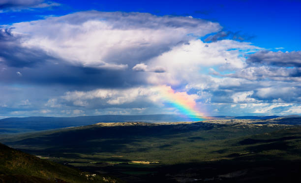 istock Rainbow in Norway mountains landscape background 648675040
