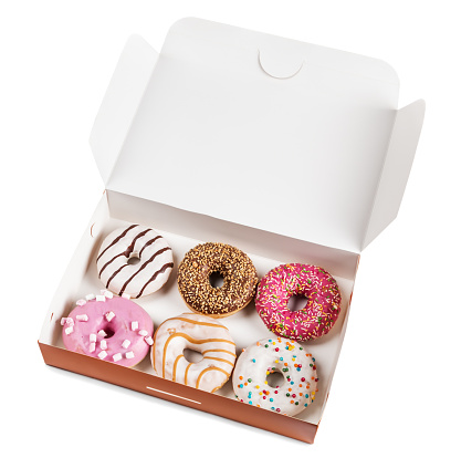 assorted donuts with different fillings in the box isolated on white background