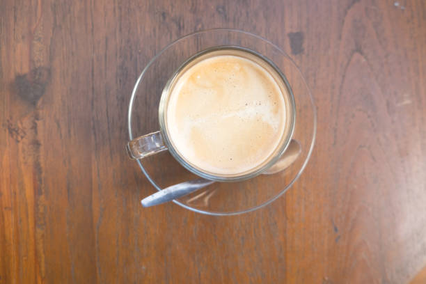 istock cup of hot coffee on wood background 648675634