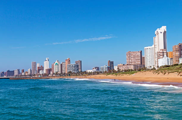 istock Coastal Landscape Beach Ocean Blue Sky and City Skyline 648682536
