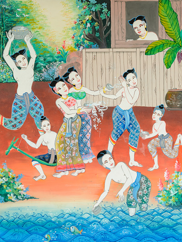 Native Thai mural painting of Songkran festival in the past on temple wall at Wat Sri Kun Muang in Loei, Thailand.
