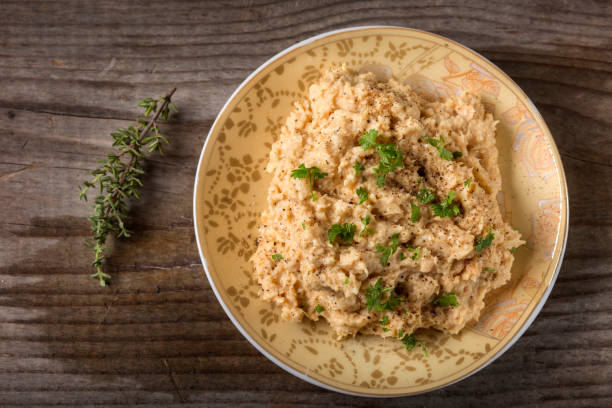 istock Cream made from mashed chicken breast with herbs and ground black pepper over wood 648684832