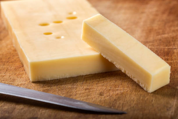 istock Emmental cheese with knife on wood 648687954