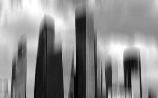 istock Vertical black and white motion blur office skyscraper backgroun 648688070