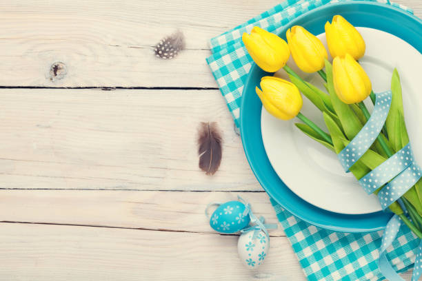 istock Easter background with yellow tulips and colorful eggs 648690798