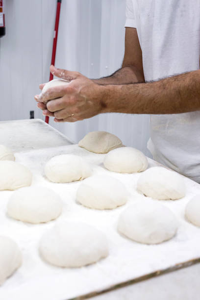 istock Hands hold the dough and the bread 648694706