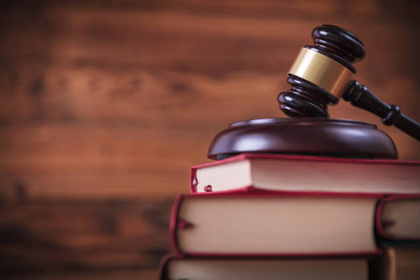 istock books with judge's hammer on top 648700558