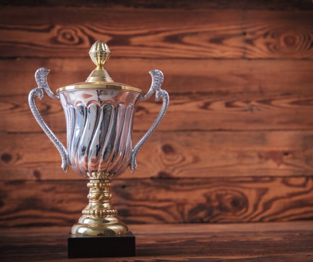 istock trophy award on old wood background 648700608