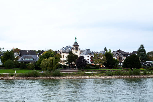 Southern outskirts of Koblenz at Rhine seen from Rhine. Some people are on promenade.