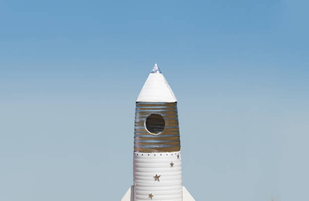 istock Big hand made toy rocket standing outdoor against sky 648705236
