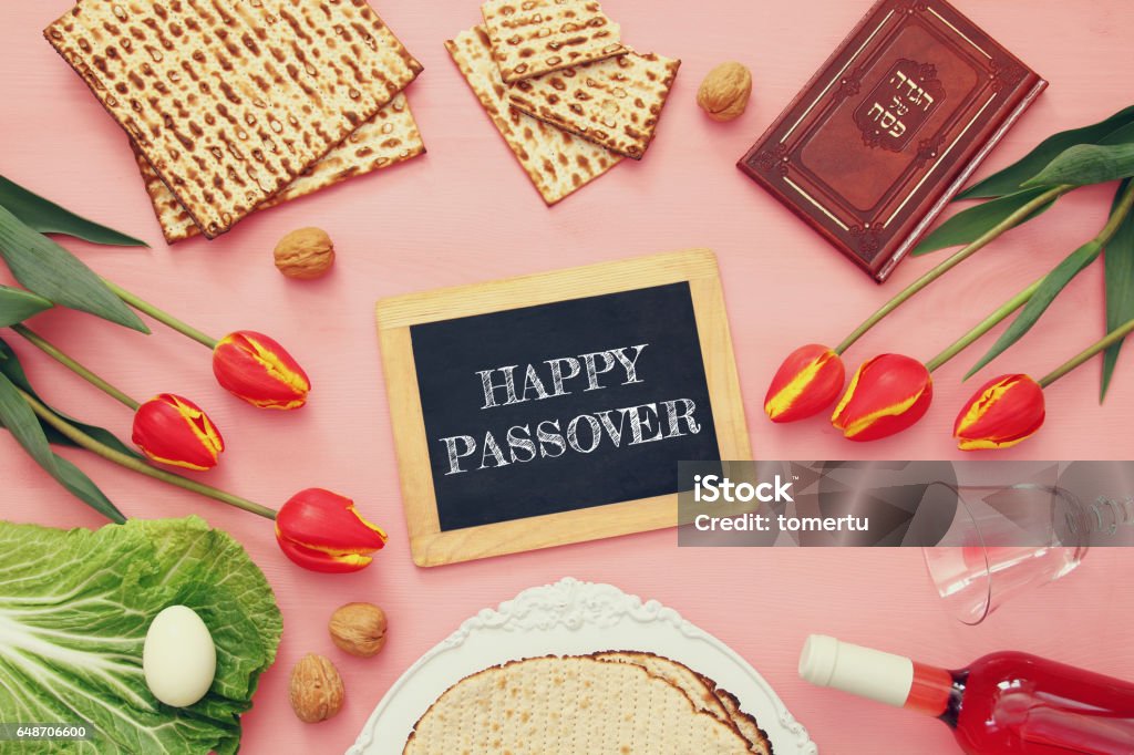 Pesah celebration concept (jewish Passover holiday) Pesah celebration concept (jewish Passover holiday). Traditional book with text in hebrew: Passover Haggadah (Passover Tale) Bread Stock Photo