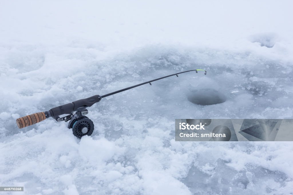 Ice Fishing Rod On Frozen Lake Covered With Snow Stock Photo - Download  Image Now - Ice Fishing, Fishing Reel, Bass - Fish - iStock