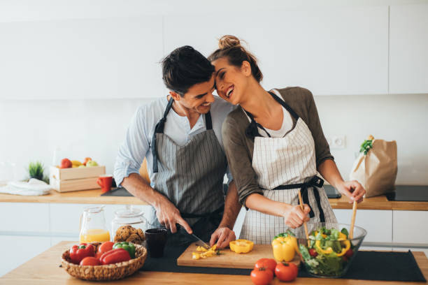 istock Young couple cooking in the kitchen 648717782
