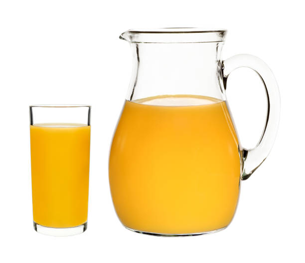 istock peach juice in a glass and carafe 648727570