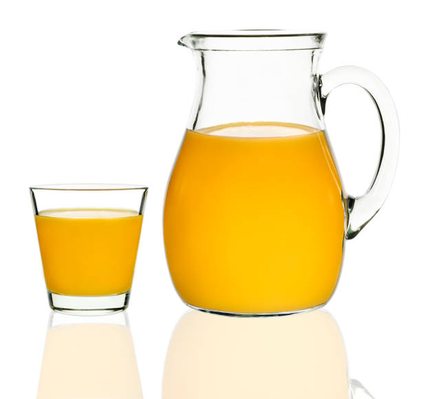 istock peach juice in a glass and carafe 648727630