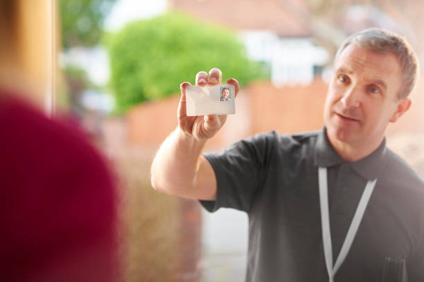 istock housing officer calling on homeowner 648732770