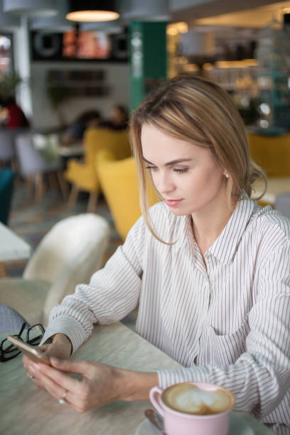 istock Beautiful woman using smartphone 648736090