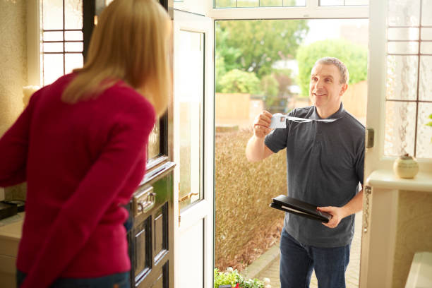 istock tradesman showing his Id badge 648736436