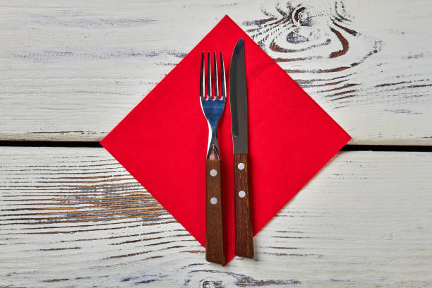 istock Red napkin on wooden surface. 648740072
