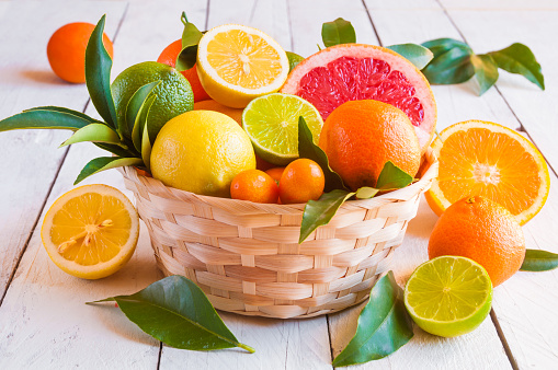 Assorted cut citrus fruits (grapefruit, oranges, lime, lemon)
