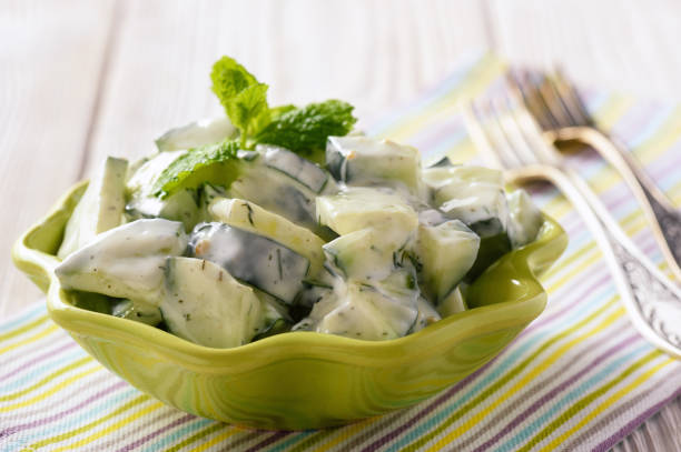 istock Cucumber salad with natural yogurt, garlic and dill. 648748910