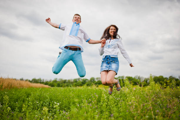 istock Brother with sister having fun on field 648759956