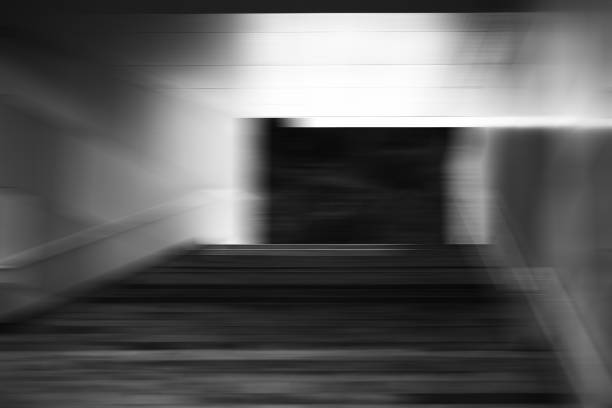istock Black and white business stairs bokeh background 648764804