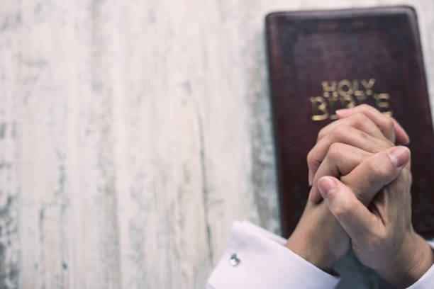 istock Woman praying for her family 648767322