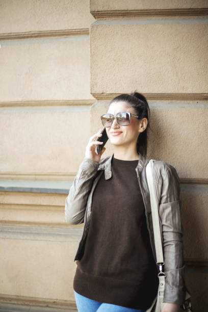istock Young women talking on mobile phone 648768350