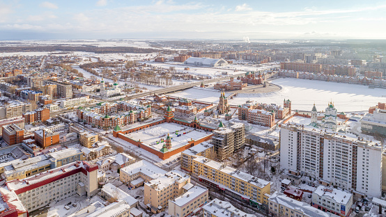 Scenic urban skyline. Winter town at a clear sunny day. City Yoshkar-Ola, Mari El Republic, Russia. Bird's-eye view
