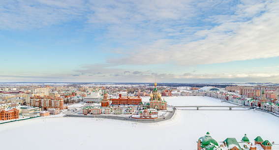 Scenic urban skyline. Winter town at a clear sunny day. City Yoshkar-Ola, Mari El Republic, Russia. Bird's-eye view
