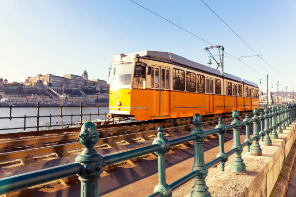 istock Typical Yellow Tram on the Danube Riverside in Budapest 648773564