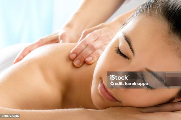 Woman With Relaxing Face Expression In Spa Stock Photo - Download Image Now - Massaging, Spa, Massage Therapist