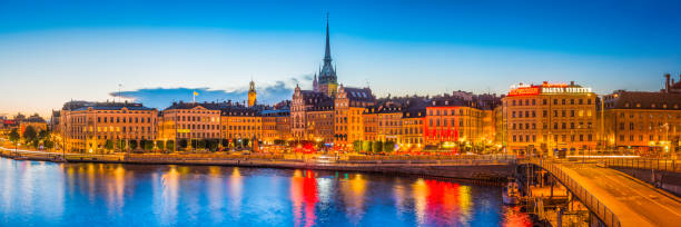 istock Stockholm colourful bars restaurants Gamla Stan waterfront illuminated panorama Sweden 648773780