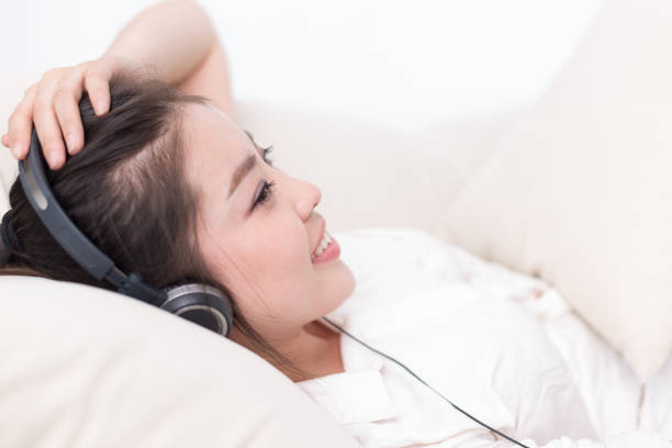 istock young pretty woman relaxes with mobile phone 648773996