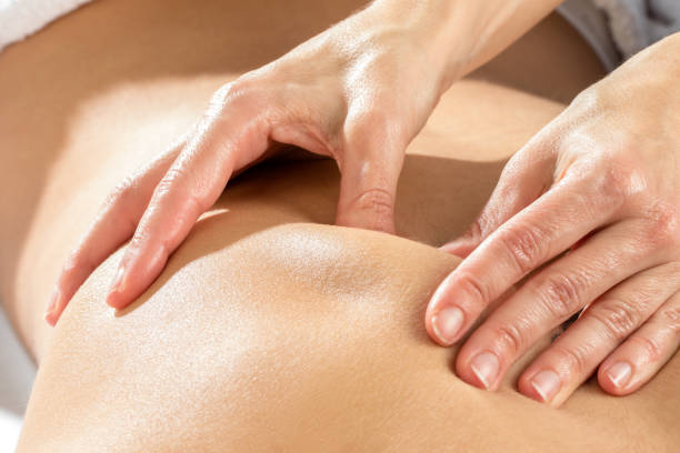 istock Detail of hands massaging shoulder blade. 648774244