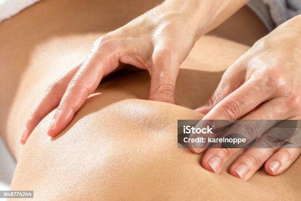 Detail Of Hands Massaging Shoulder Blade Stock Photo - Download Image Now - Massaging, Osteopath, Physical Therapy