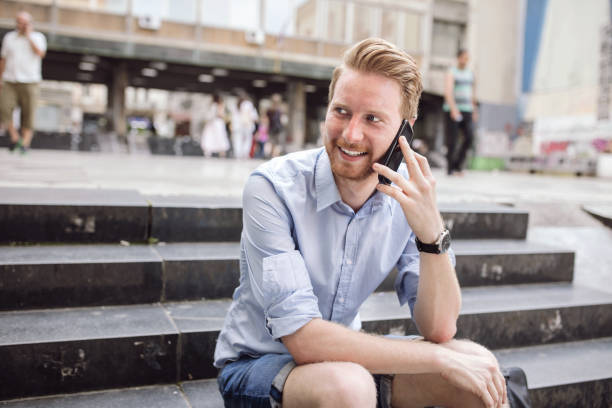 istock Ginger menager talking on the phone with his beloved 648780796