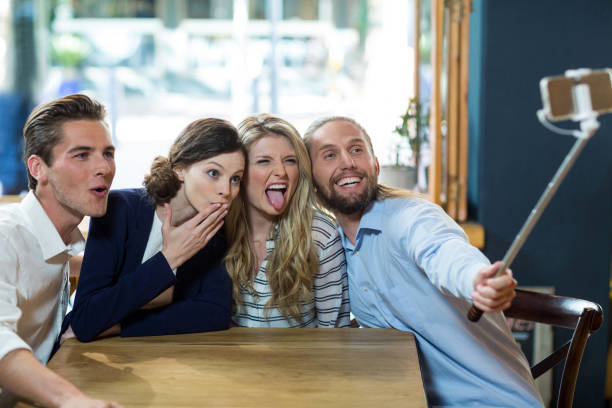 istock Happy friends taking selfie from mobile phone 648780860
