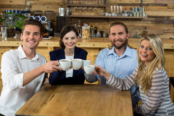 istock Young friends toasting with coffee cups 648781186