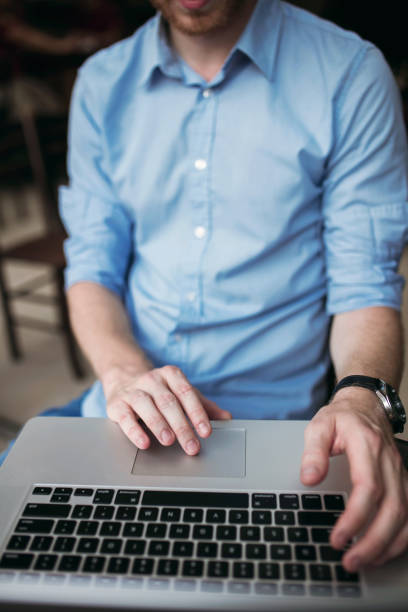 istock Close up of handsome guy on laptop 648781308