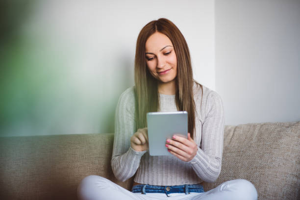 istock Women reading on the tablet 648781604