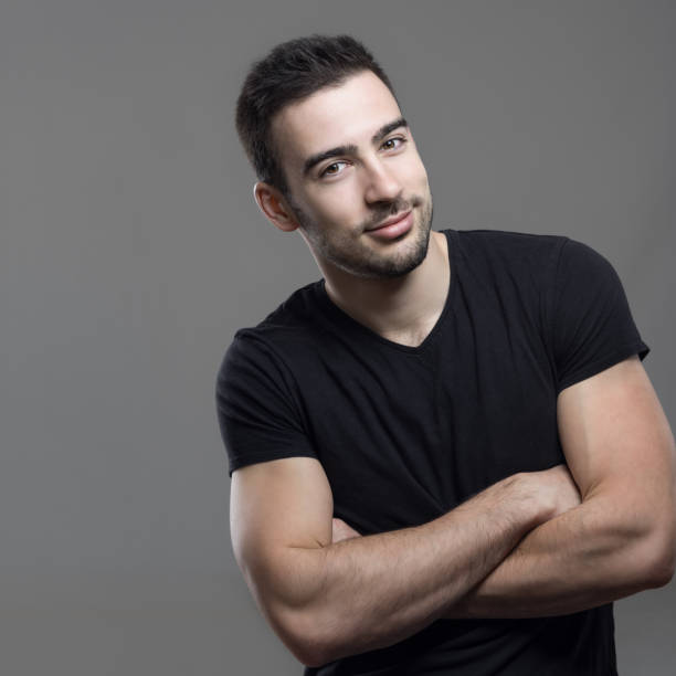 istock Smiling happy athletic man with crossed arms looking at camera 648792678