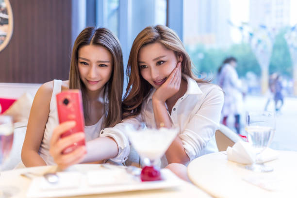 istock Two happy woman friends in restaurant 648794354
