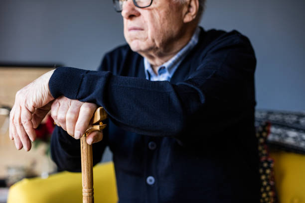 istock Hand of a old man holding a cane 648799868