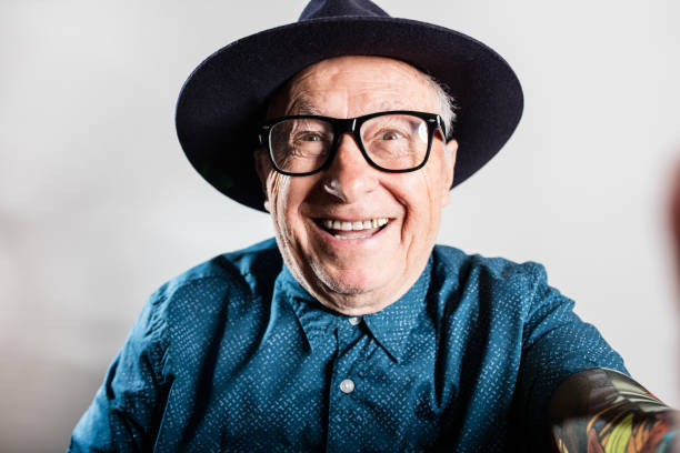 istock Happy smiling senior man taking a selfie 648800322