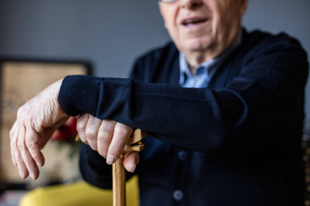istock Hand of a old man holding a cane 648803204